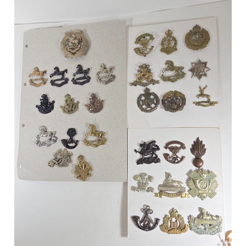 416 - Thirty-one mostly restrike cap badges, including a set of King's Liverpool Regt. Territorial Bns., o... 