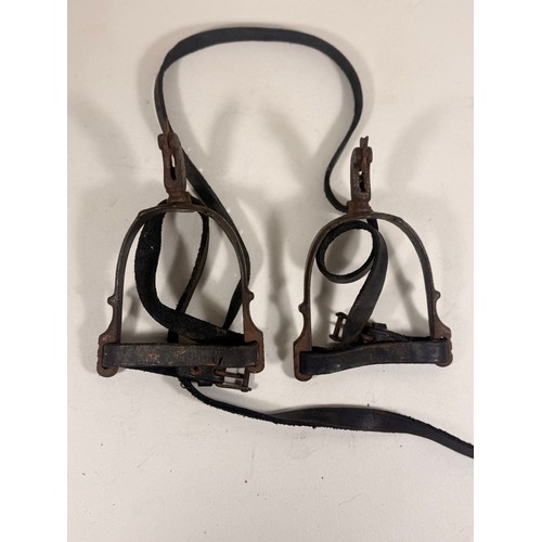 747 - A pair of possibly 17th Century iron cavalry spurs complete with buckled leather straps, GC