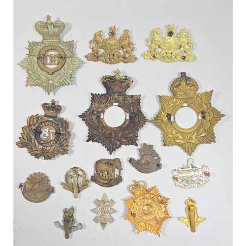 413 - A small quantity of re-strike helmet plates etc. including three 1869 shako plates, 1878-81 OR's HP ... 