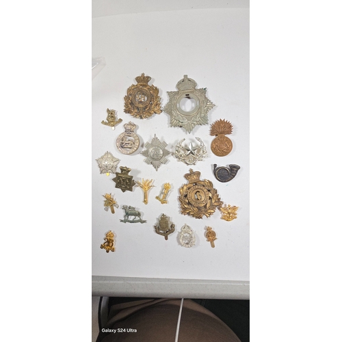 413 - A small quantity of re-strike helmet plates etc. including three 1869 shako plates, 1878-81 OR's HP ... 