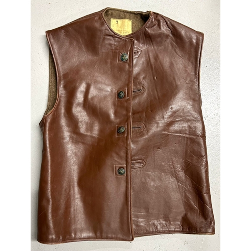 407 - A Belgian military style brown leather jerkin lined with khaki cloth, label of ‘H. Gurmann, Bruxelle... 