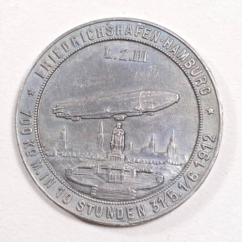 534 - A greymetal medallion depicting Graf Ferdinand von Zeppelin, the reverse showing the airship L.Z.III... 