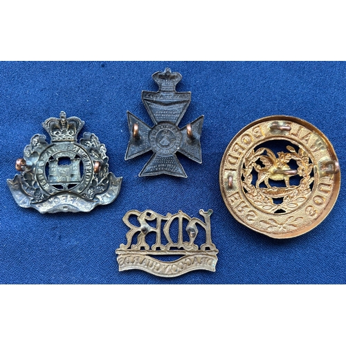 410 - Victorian cap badge of the Suffolk Regiment; collar badge of H.M.R.R. Dragoon Guards (lugs af); smal... 