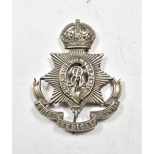 412 - An Indian mess servants white metal pugri badge of the Indian medical service, with pin fitting. GC