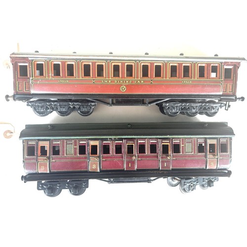 34 - 2 O Gauge Passenger Coaches. An early Marklin LMS 1st/3rd 8 wheeled bogie Passenger Coach. In LMS Cr... 