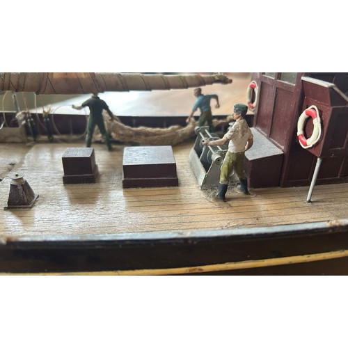 55 - A lovely built model of a fishing schooner, HF408. Built from wood and plastic, cloth sails, life bo... 