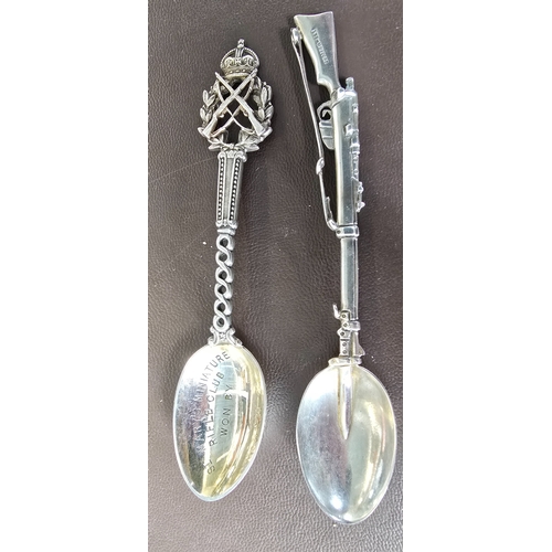 332 - A silver teaspoon the handle in the form of a Lee Metford Rifle, HM London 1903 and a St. Mary's Rif... 