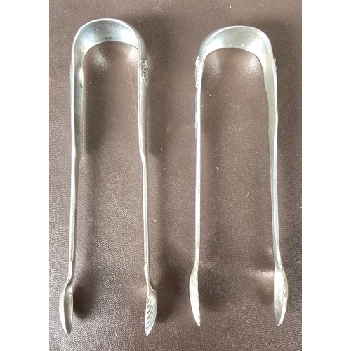 323 - A pair of Scottish silver sugar tongs, fiddle and shell pattern, Hm Edinburgh 1823, makers mark W&am... 