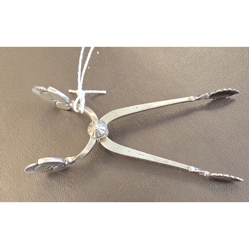 348 - A pair of Georg Jensen Danish silver sugar nips in cactus pattern, approx. weight 23gms. GC