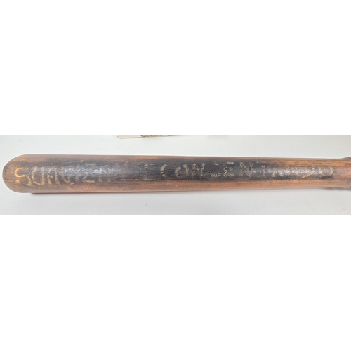 359 - An unusual turned wooden truncheon with leather wrist loop, painted with Spanish inscription 