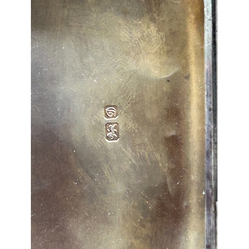 354 - An Edwardian silver cigarette case engraved overall with scrolls and monogram, HM Chester 1904. GC, ... 
