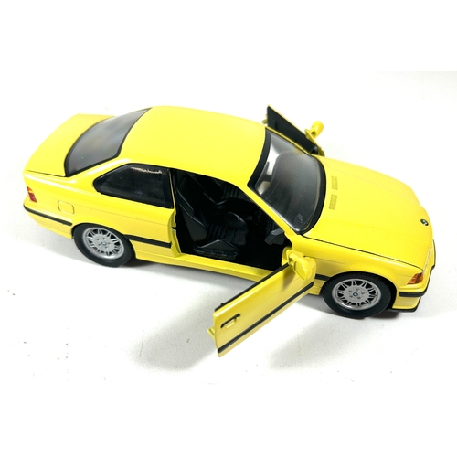 9 - A scarce 1995 BMW Point-of-Sale 1:24 scale model of an E36 3 Series M3. Finished in yellow with blac... 