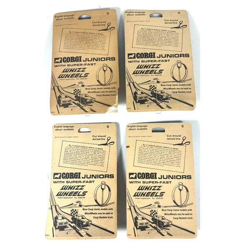 23 - 4 Corgi Juniors 'Whizzwheels' No.11 Austin-Healey Sprite Le Mans. All still sealed onto their origin... 