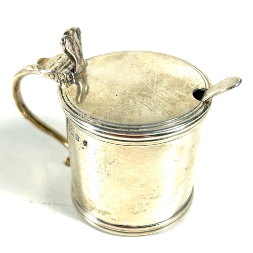 29 - A silver mustard pot and spoon, missing  liner, of plain design. London 1862, by CRC. Weight 75gms.