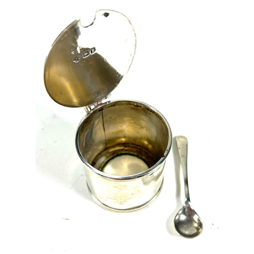 29 - A silver mustard pot and spoon, missing  liner, of plain design. London 1862, by CRC. Weight 75gms.