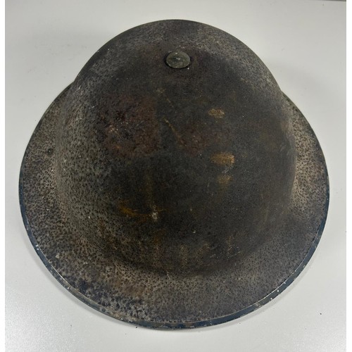 57 - British Army officers peaked cap badged to the Royal Army pay corps. Also a WW2 steel helmet with tr... 