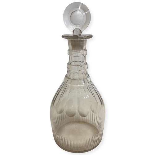 An Early 19th Century Three Ring Decanter with target stopper. Ground