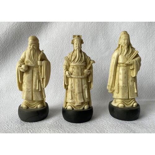 25 - Three early 20th century carved ivory figures and an early 20th century carved ivory circular box