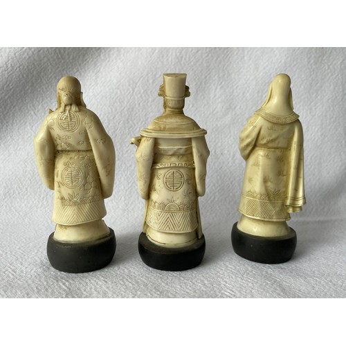 25 - Three early 20th century carved ivory figures and an early 20th century carved ivory circular box