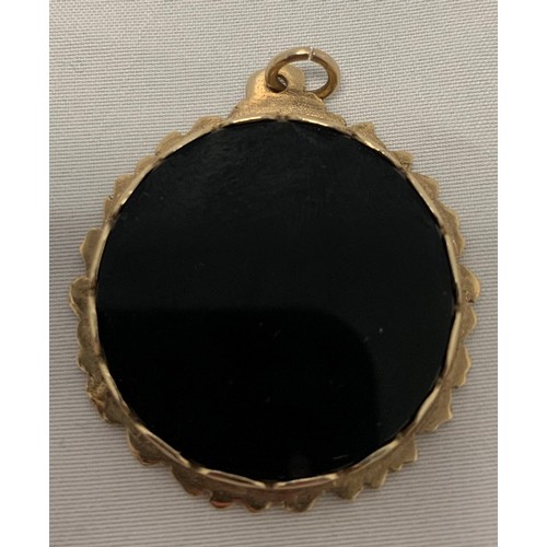 53 - A 9ct Gold and Onyx Star of David Pendant (12g gross)