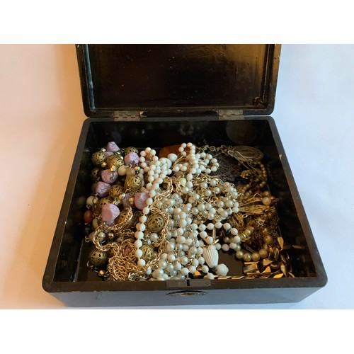 64 - A Wooden Jewellery Box containing a quantity of Dress Jewellery.  
To include Seven Lady's watches, ... 