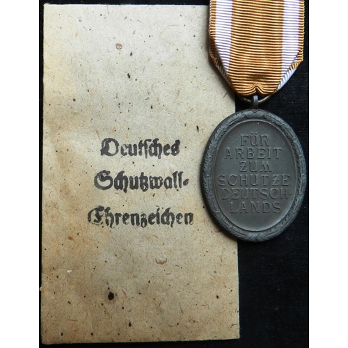 12 - WW II West Wall Medal. With envelope.