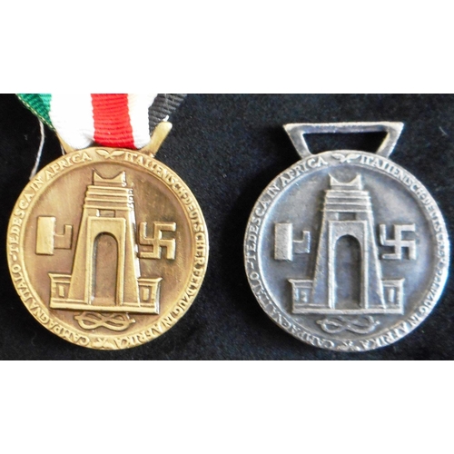 27 - (2) German – Italian North Africa Medal. Another cast version.