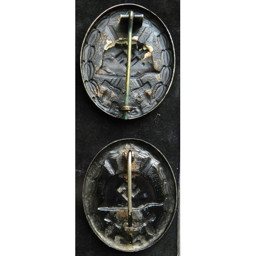 48 - (2) WW II Wound badge in black. Another, both stamped steel. Both with some wear, both 0.3oz. Possib... 