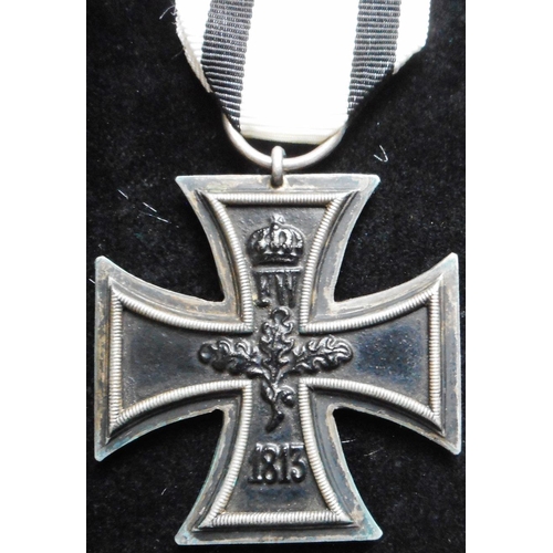 71 - WW I Iron Cross 2nd class. Non-combatants ribbon. Suspension ring stamped V