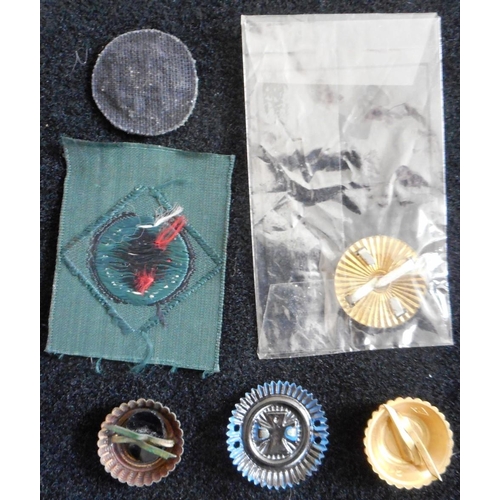 120 - Feldmütze cloth cockades, un-used, 4 other metal cockades including one in its original packet.