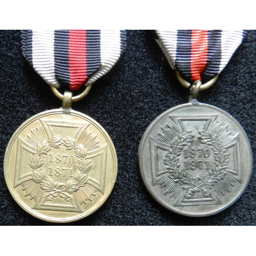 159 - (2) Prussia. 1870-71 Campaign Medal. Impressed rim. another non-combatants medal in steel.