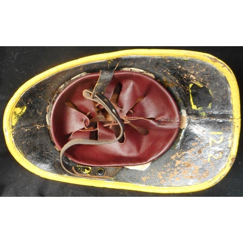 183 - Fire helmet. Leather Hendry. In yellow, 1st pattern Merseyside F.B. badge. Remains of Sub. O’s marki... 