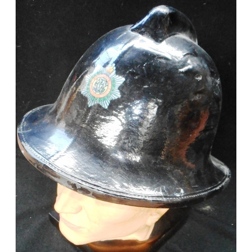 184 - Fire helmet. Black Cromwell cork. Liverpool Fire Brigade badge. Some impact damage. Named to Worrall... 