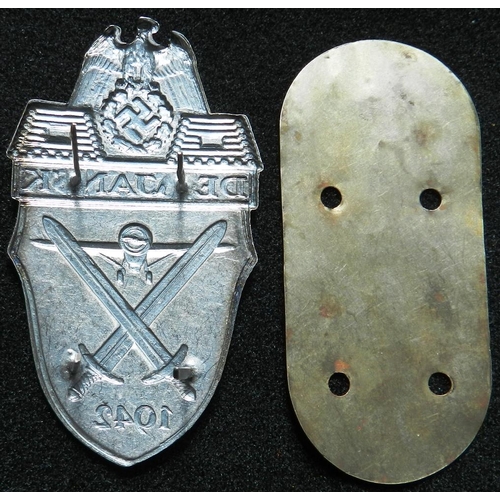 204 - WW II Demjansk shield. Die-stamped, non-magnetic zinc, heavy prongs, tin backing plate, no cloth. So... 