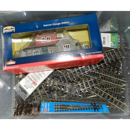 103 - 2 boxes of Peco-Lectrics fittimgs, bridges, other spares etc. Also quantity of track.