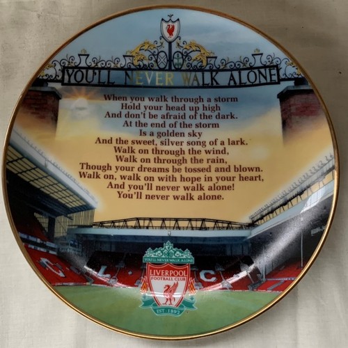 137 - Liverpool FC Interest: A box of Liverpool FC Memorabilia to include a small piece of the kop, progra... 