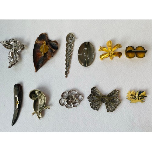 44 - A Collection of 11 Brooches Including 2 x Silver Brooches 
An Interlaced Dragon Celtic Style Silver ... 