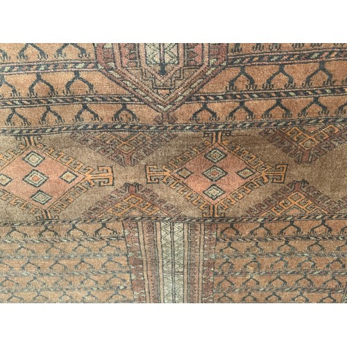 191 - Turkoman Hatchli Rug with Numerous Motifs on Brick Red Ground
Approx. 175 x 124 cm