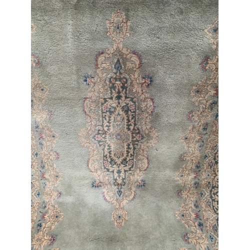 194 - Rectangular Rug on celadon ground with ornate floral boarders around a floral central medallion
Appr... 