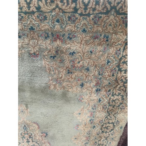 194 - Rectangular Rug on celadon ground with ornate floral boarders around a floral central medallion
Appr... 