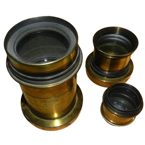 49 - 3 lenses. Ross 15 x 12 Rapid Symmetriant, Lancaster & Sons 40mm lens, 1 other. All brassed.