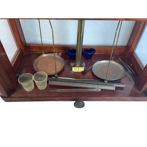 232 - A Set of Vintage Scales in Glass Case with a Part Set of Weights and a Hydrometer.