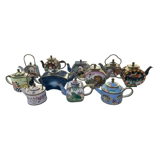 295 - Eleven Enamel hand painted Trade+Aid collectable small tea pots , approximately 9cm tall. No obvious... 