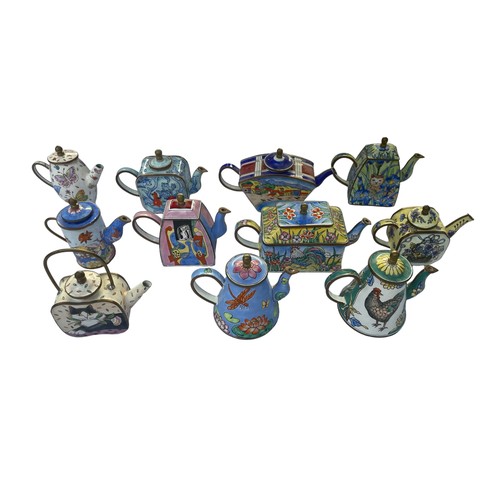 297 - Eleven Enamel hand painted Trade+Aid collectable small tea pots , approximately 9cm tall. No obvious... 