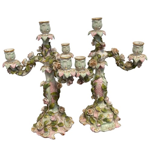 306 - A pair of Sitzendorf porcelain three arm candlesticks with elaborate flowers design
approx 33cm tall