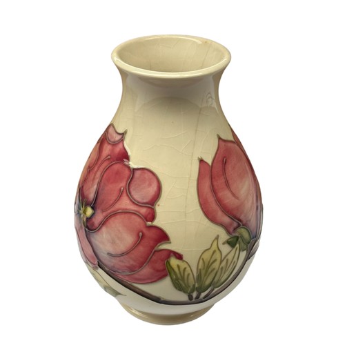 303 - A Moorcroft Magnolia pattern baluster vase, 19cm, impressed and painted marks