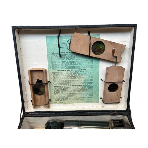 19 - Magic Lantern 'Lanterna Magica', original boxed magic lantern, with a collection of colour printed s... 