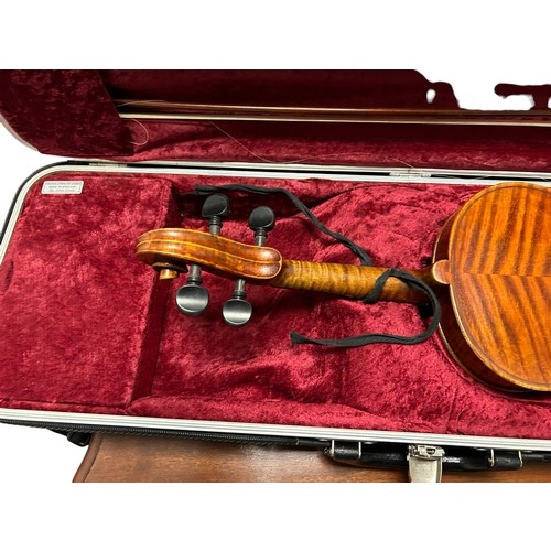 88 - A 20th century violin by Carlo Storioni, length of back 361mm, interior label dated 1902, with Hisco... 