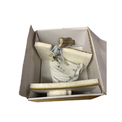 239 - A LLADRO PORCELAIN FIGURE, 'Petals on the Wind' model no 06767 boxed a current issue, height 23cm (C... 