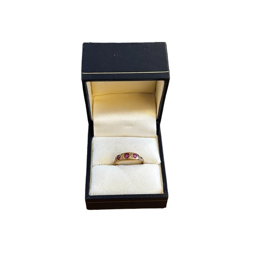 182 - 18ct Gold set Three Ruby ring 1.7g gross approx size L